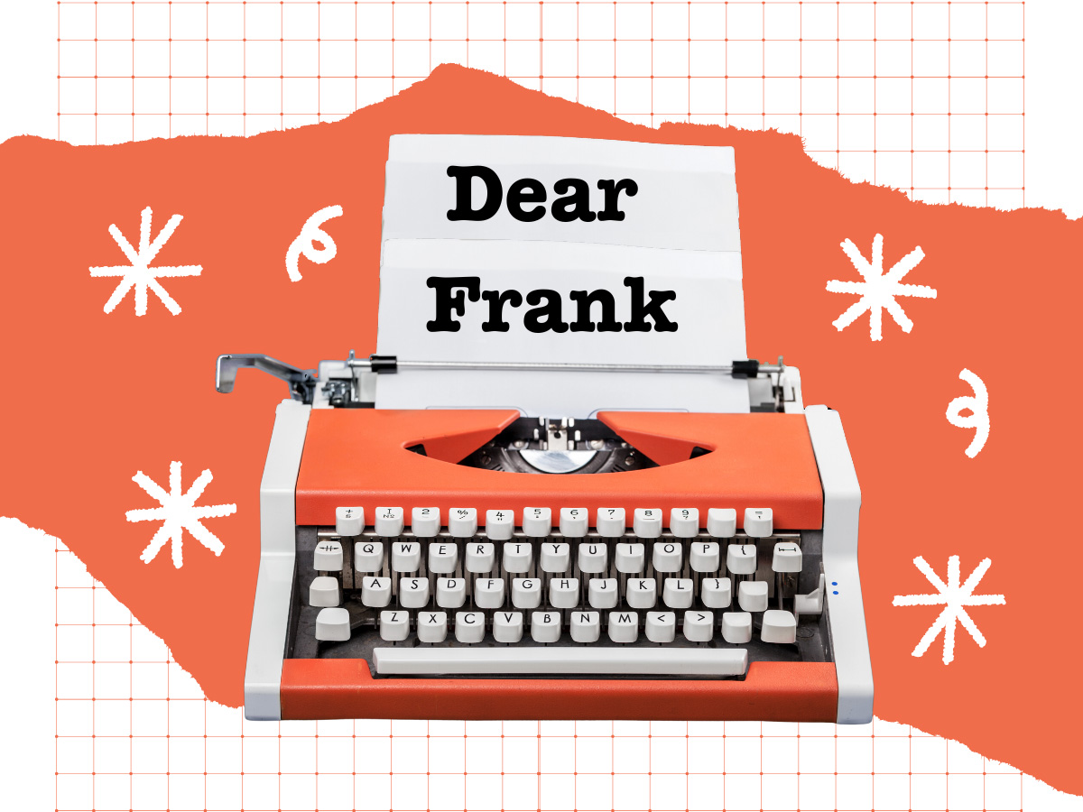 An orange typewriter with the piece of paper displaying the words 