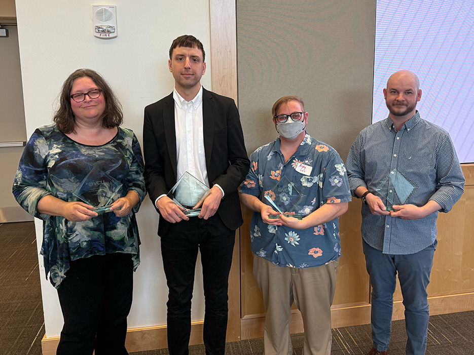 Left to right: Juliana Rasnic, Nathan Bickett, Rigby Bendele and Cole Cridlin hold award plaques