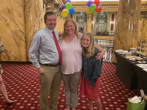 Katie Hewitson inside the Jefferson Hotel with her husband and daughter