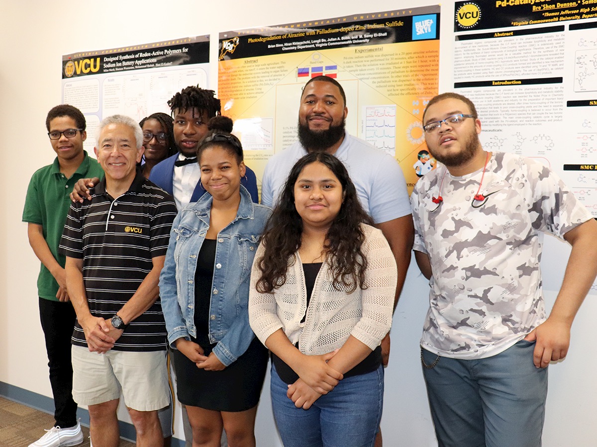 Michael Hunnicutt and Mychal Smith with Project SEED students at their poster session in August